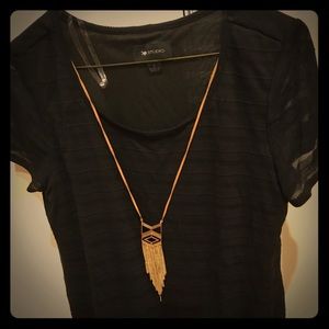 Black short-sleeve top with necklace